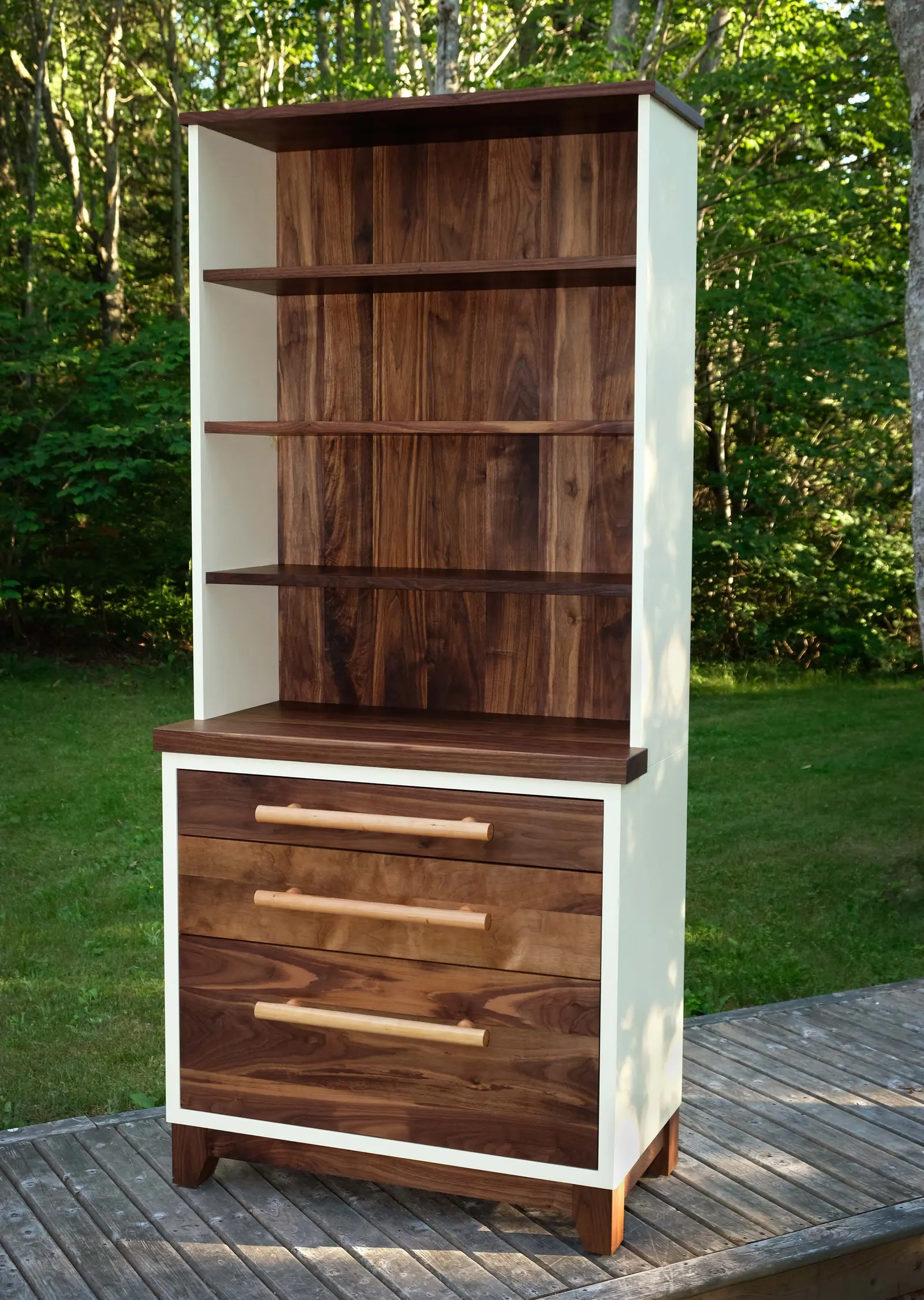 Freestanding pantry cabinet with open shelves above and drawers below