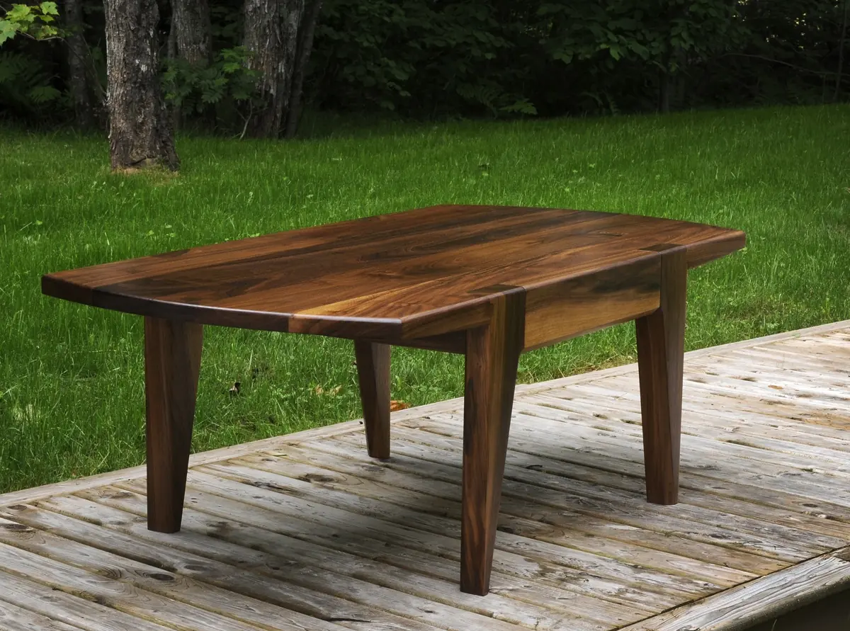 Walnut coffee table with a sculptural base